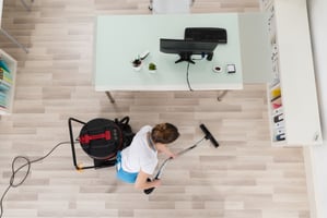 professional cleaner performing office cleaning in charlotte nc